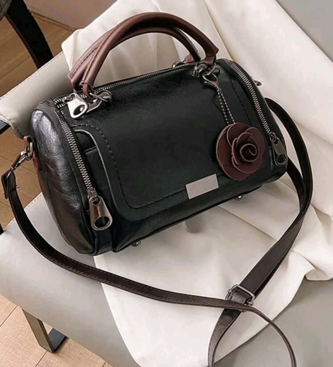two tone black leather Boston handbag shoulder bag brown handles floral keyring
