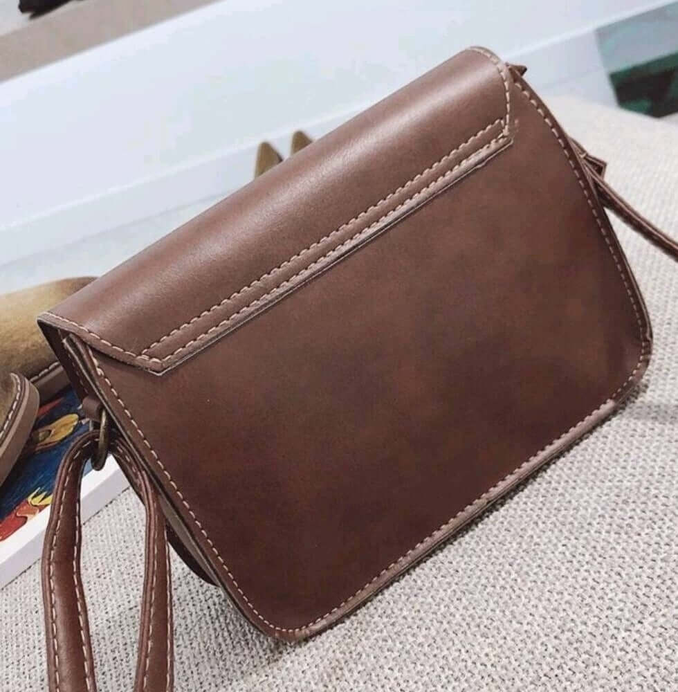 dark brown quirky lock leather shoulder bag