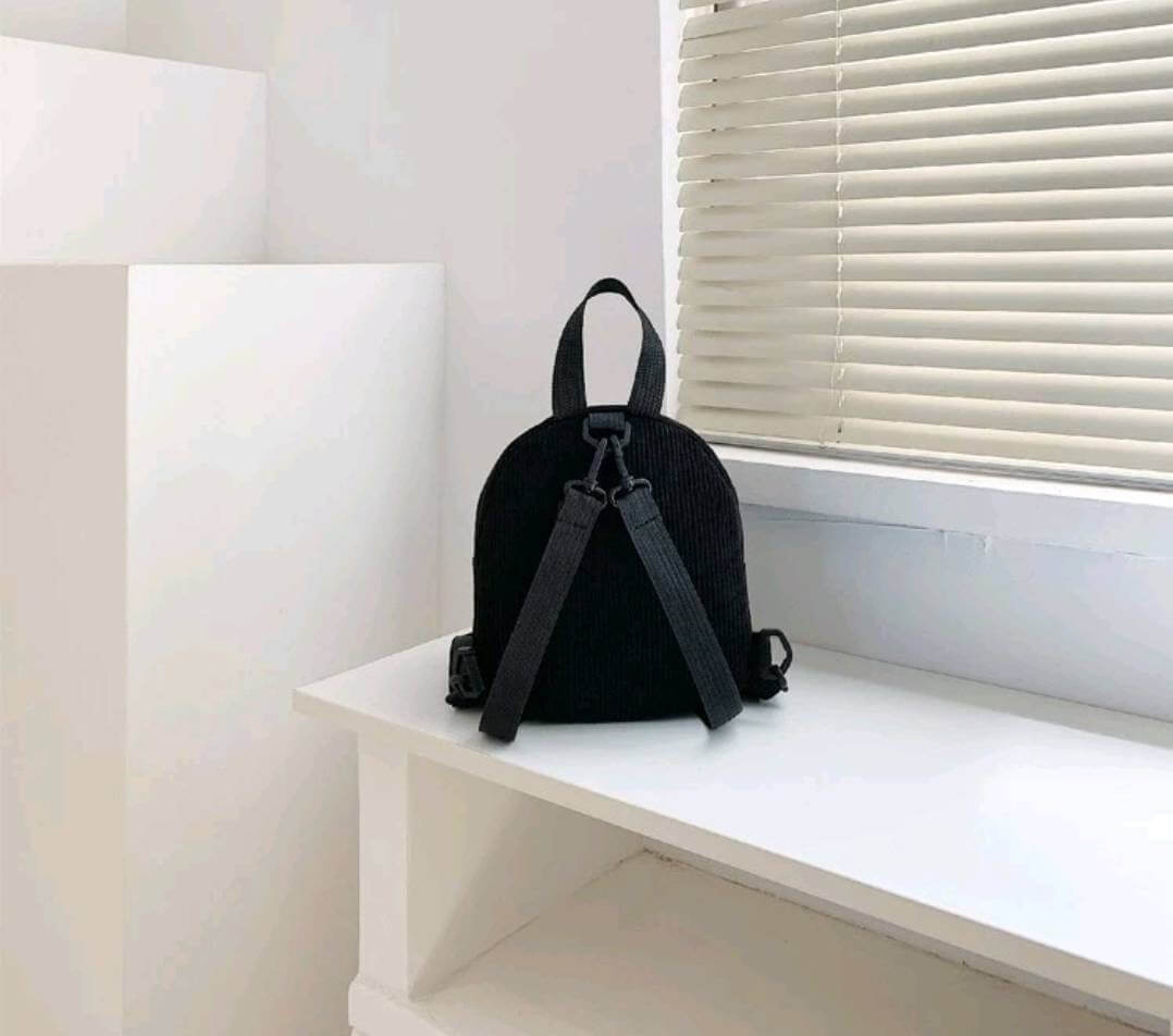 black mini corduroy double pocketed backpack