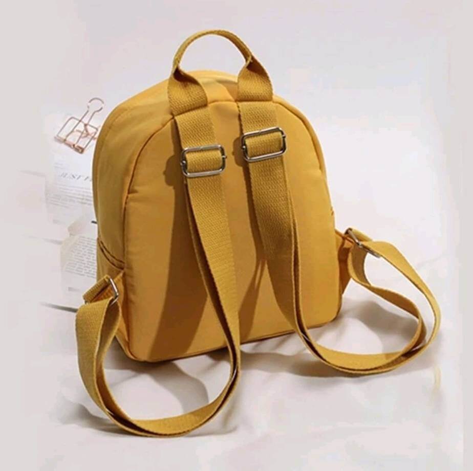 quirky yellow nylon backpack